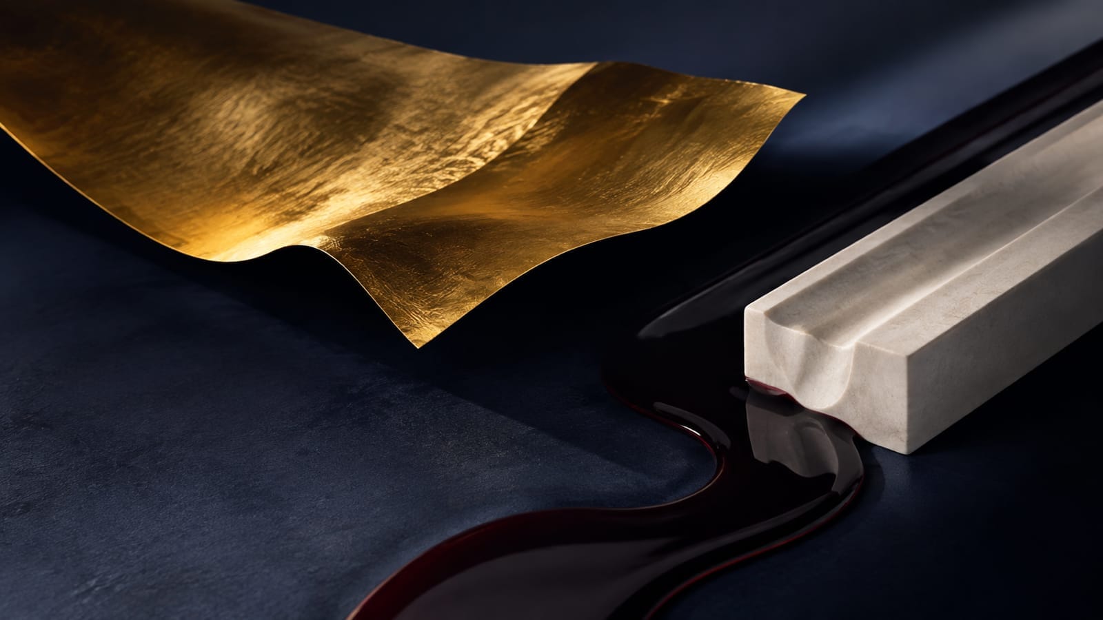 A thin brushed-gold sheet curves above a dark navy surface beside an ivory block and a dark oxblood liquid channel, symbolizing gold's recovery while oil pressure stays elevated